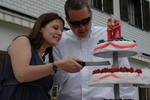 The difficult task of cutting a wedding cake